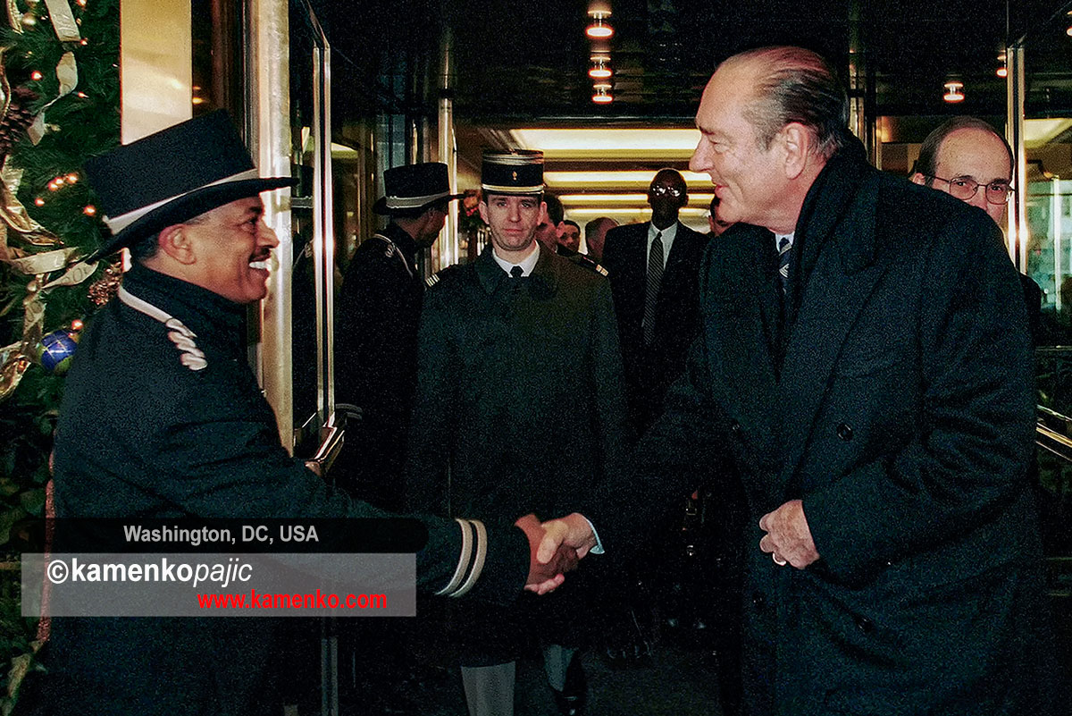 President Chirac shakes hands with a doormen