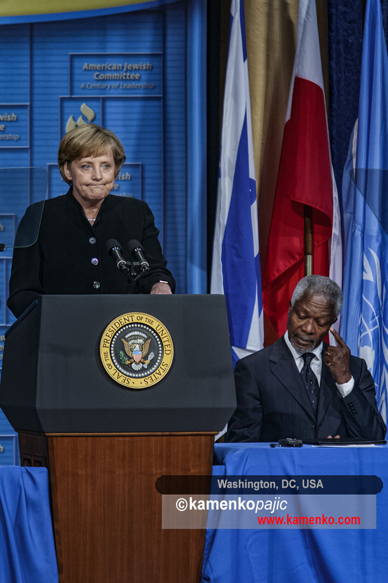 Kofi Annan listens Angela Merkel address
