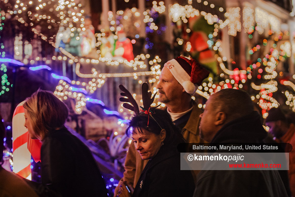 Visitor admire holiday decorations along the 700 block of 34th street
