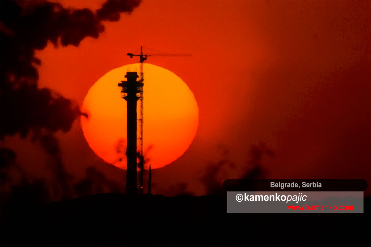 Sun rises behind silhouette of TV tower under construction on Mt. Avala near Belgrade on April 29, 2009. In 1999 NATO bombed and completely destroyed identical tower that was Belgrade’s landmark.
