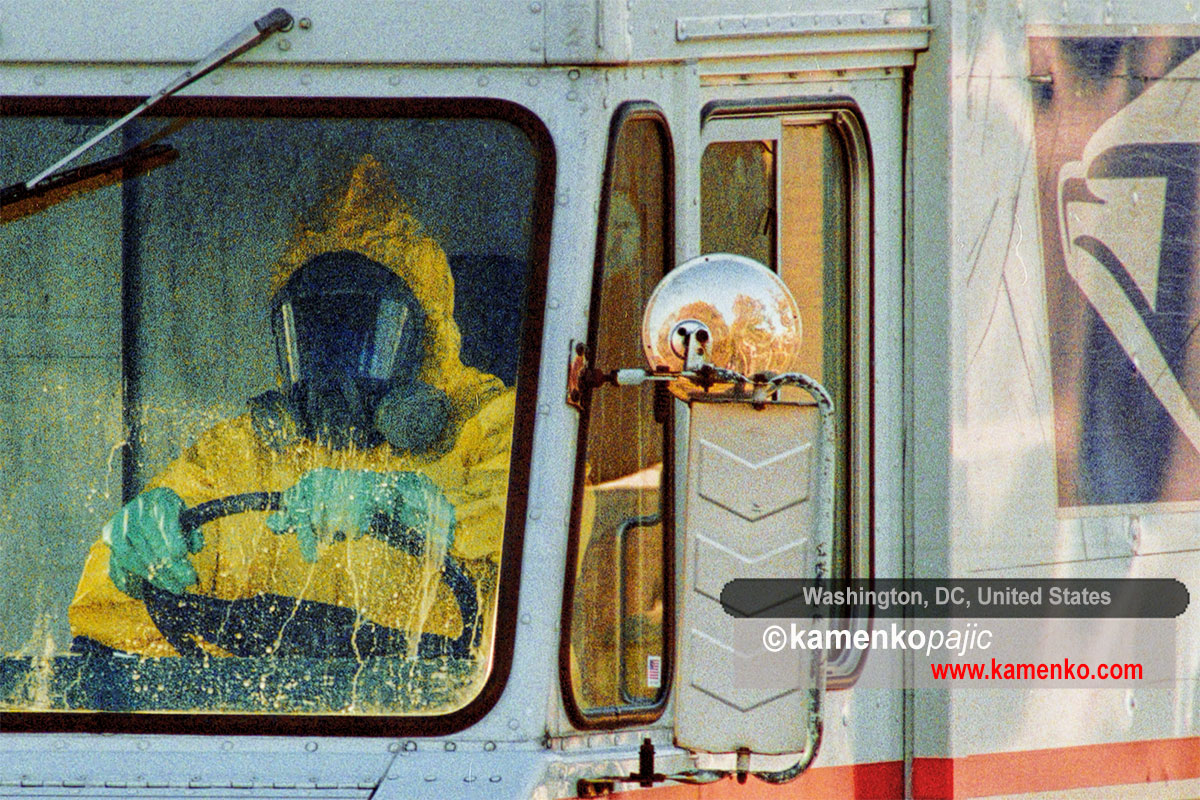 A person dressed in a hazmat suit drives a U.S. Postal Service truck from the Brentwood postal facility in northeast Washington, Thursday, October 25, 2001. Two workers at the facility died earlier in the month after exposure to inhalation anthrax