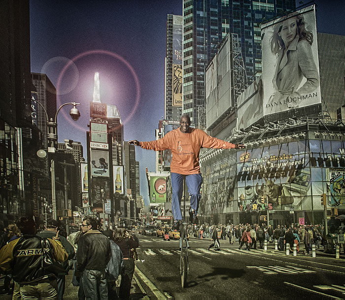 Kenneth Anderson - God Balances Lives // CD Cover Two sepatare images, NYC Times Square and Ken on monocylce combined in Photoshop. Ken wanted photo of him on monocycle, that we took on a parking lot in DC. I sugested to go with composite (photomontage). In archive I fund this shoot of Times Squere. Ken is intentionaly made larger then other people.
